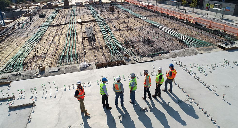 Construction Safety - photo of workers looking over construction site